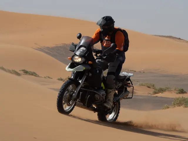 Rider in Morocco on the autumn tour, riding through sand dunes